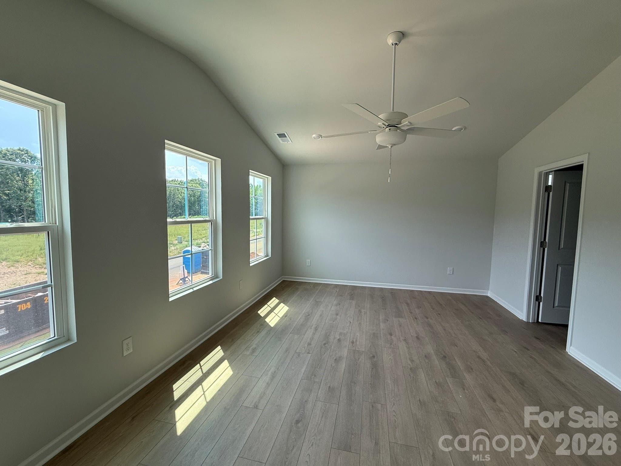 Large Primary Bedroom with Vaulted Ceiling and lots of windows for natural light - 1231 Bansal Drive, Charlotte