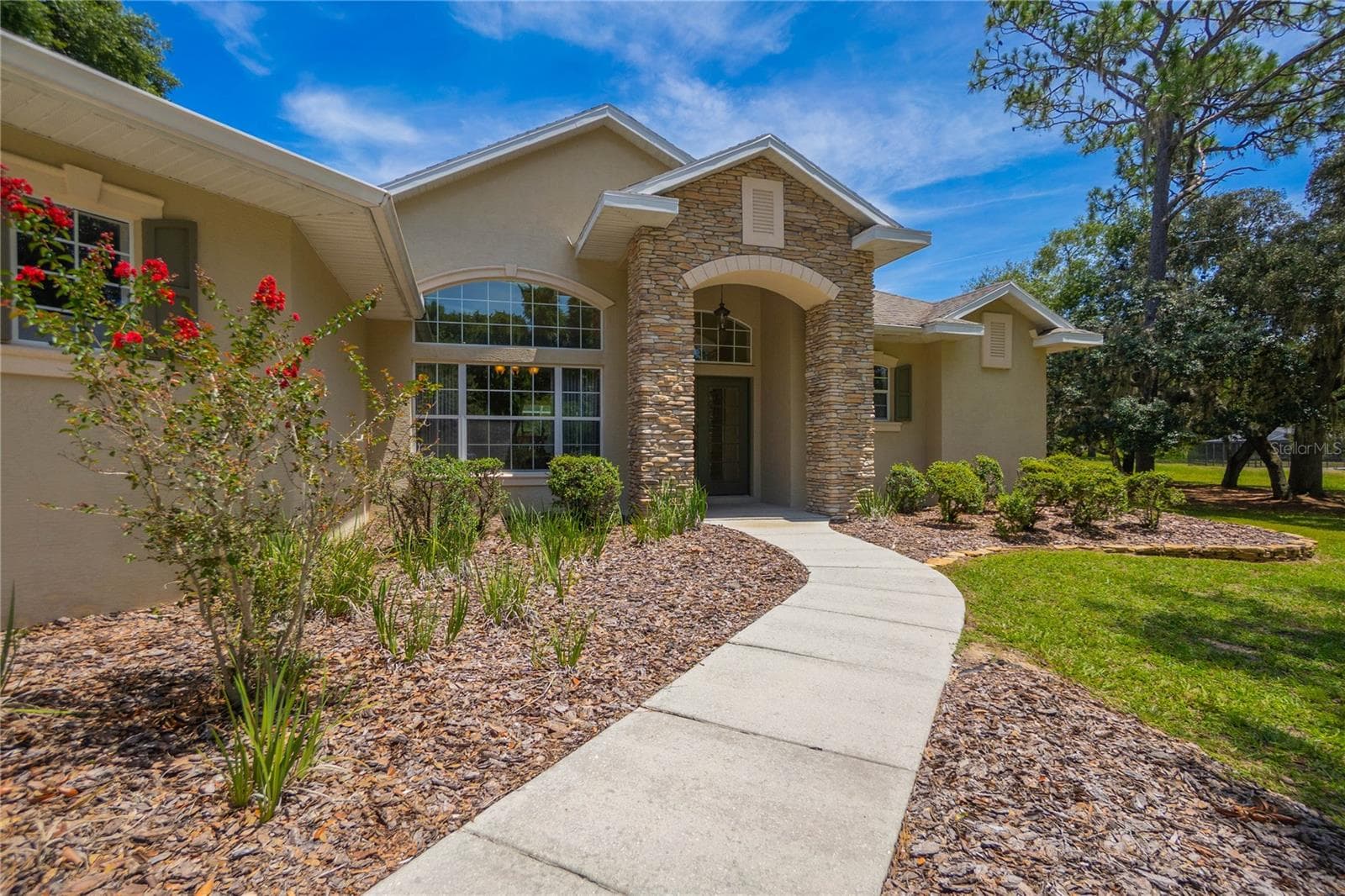 Stone-Accented Front Entrance - 9807 E LAKE TAHOE DR, INVERNESS