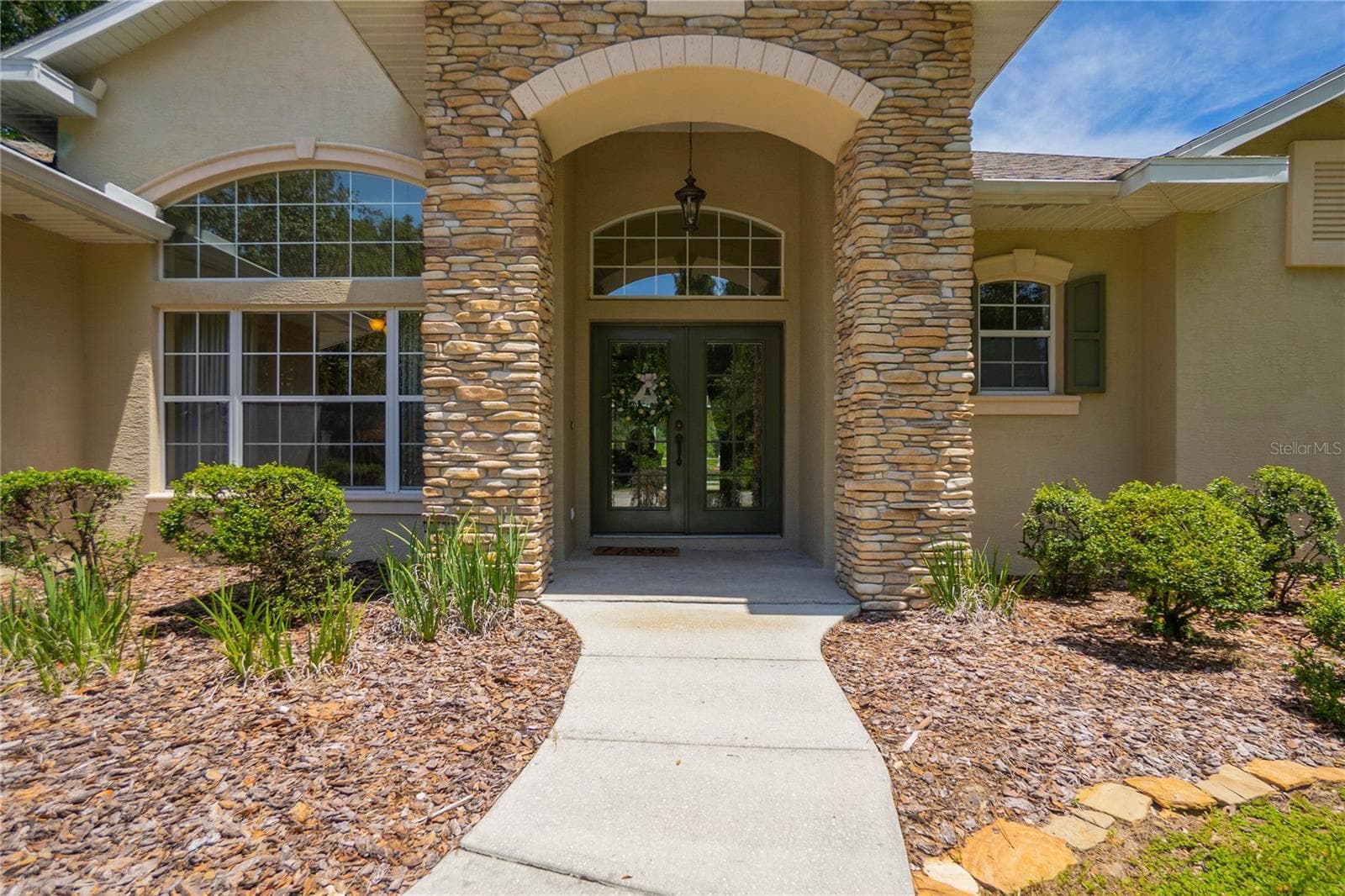 Stone-Accented Front Entrance - 9807 E LAKE TAHOE DR, INVERNESS