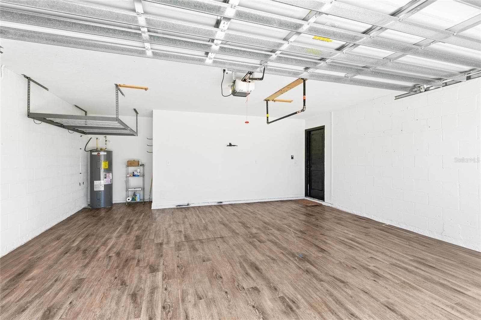 garage has custom flooring to accommodate a gym - 12272 HIGH ROCK WAY, PARRISH