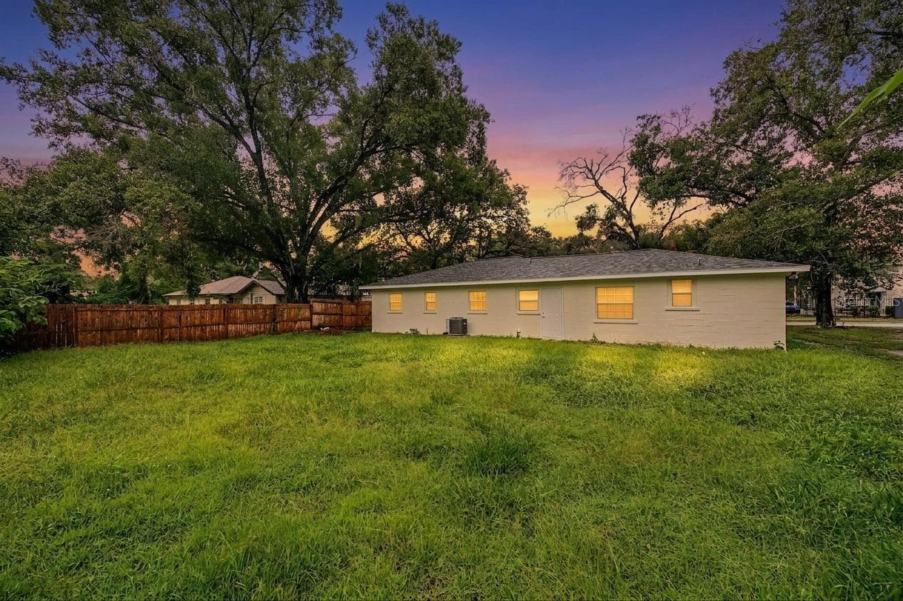 Back yard, partially fenced-in - 810 E 120TH AVE, TAMPA