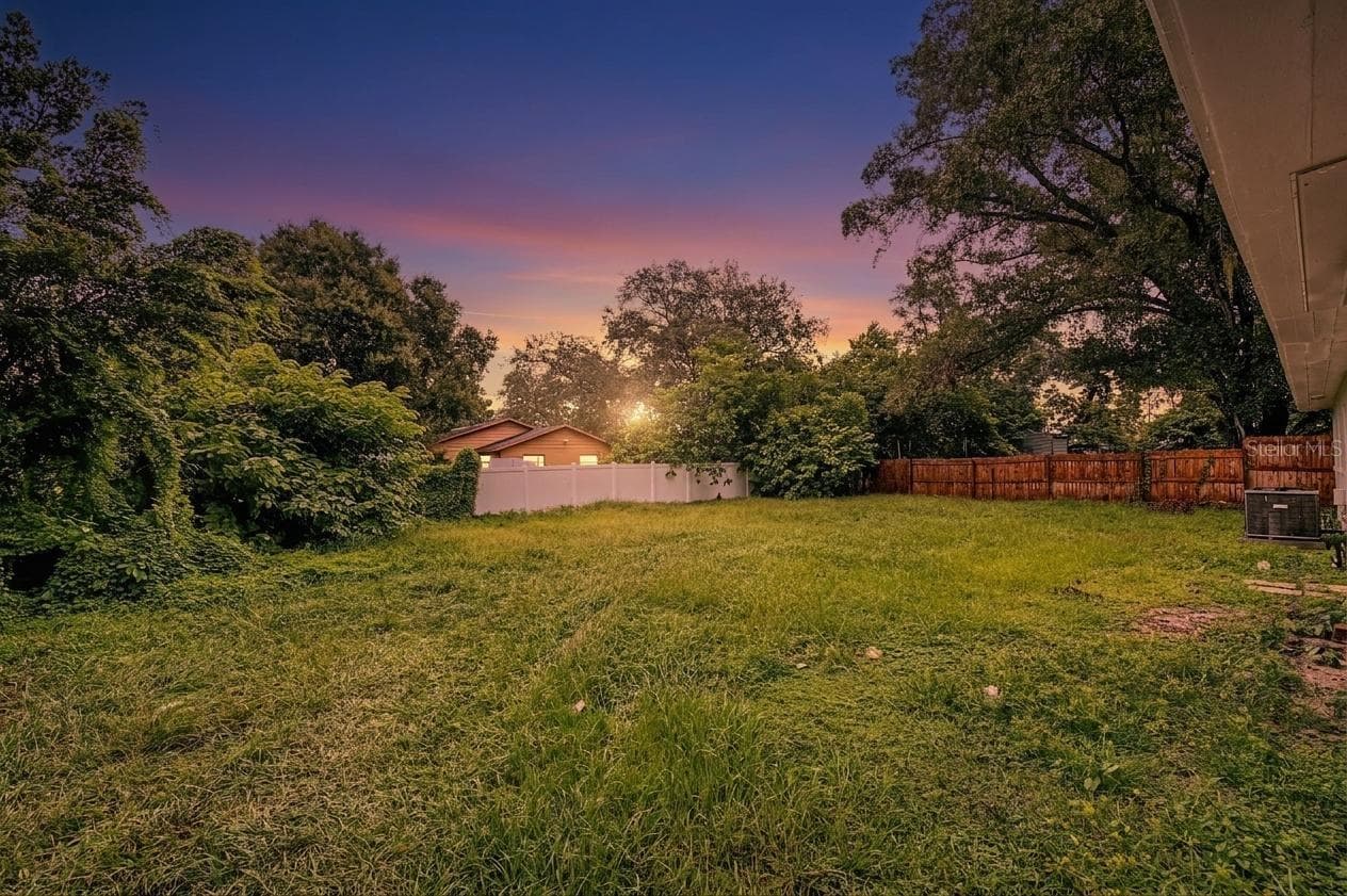 Rear Exterior, partially fenced-in - 810 E 120TH AVE, TAMPA