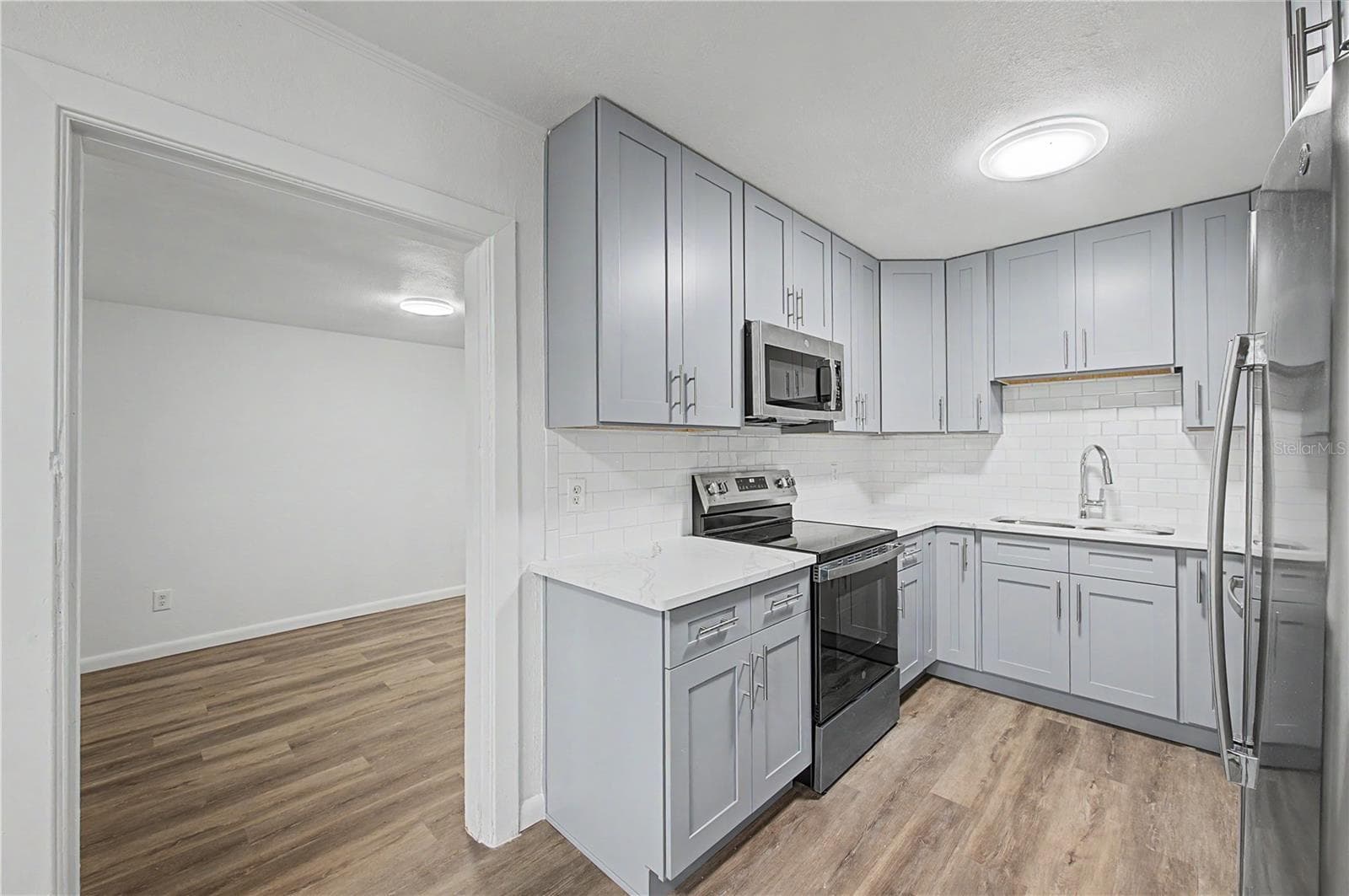 Gorgeous new kitchen, All New Appliances, Backsplash, Paint, Flooring and Light fixtures! - 810 E 120TH AVE, TAMPA