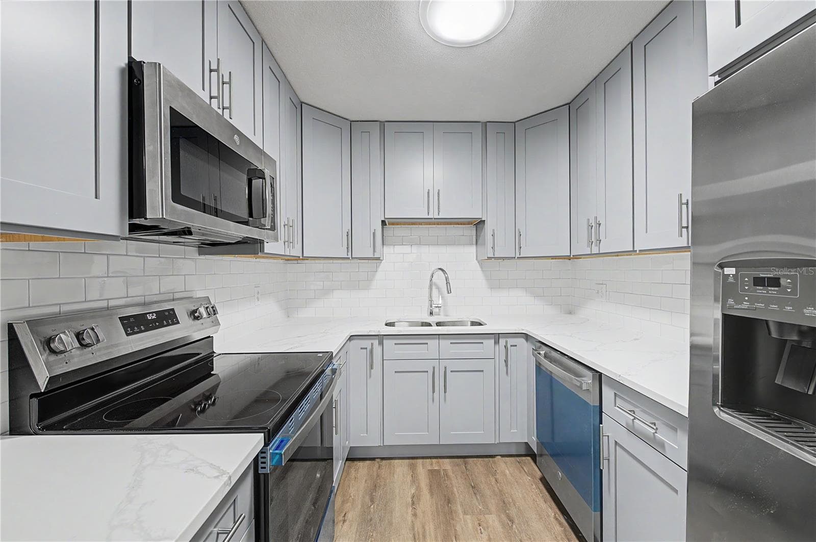 Gorgeous new kitchen, All New Appliances, Backsplash, Paint, Flooring and Light fixtures! - 810 E 120TH AVE, TAMPA