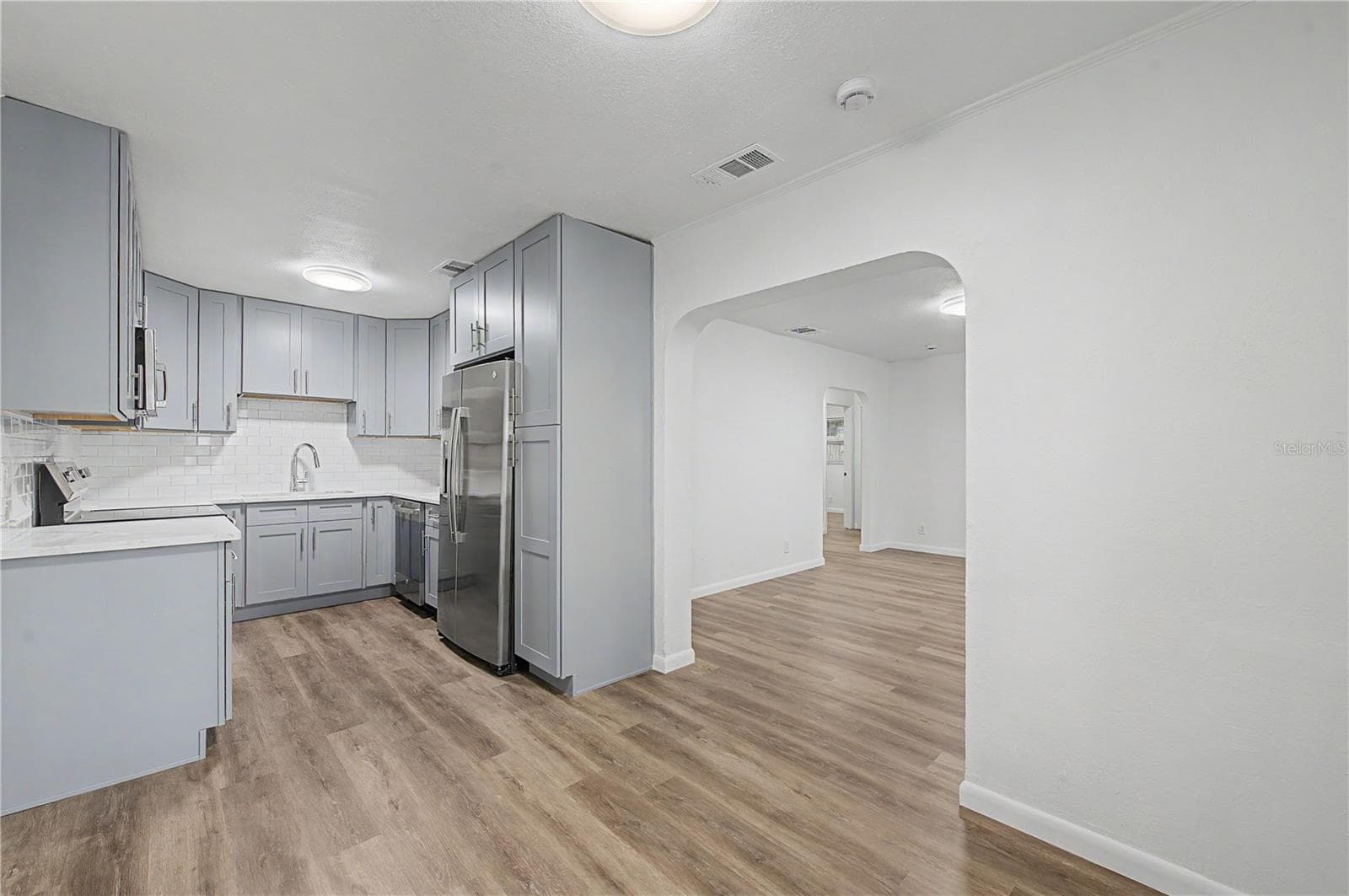 Dinette area, new flooring, blinds and light fixture. - 810 E 120TH AVE, TAMPA