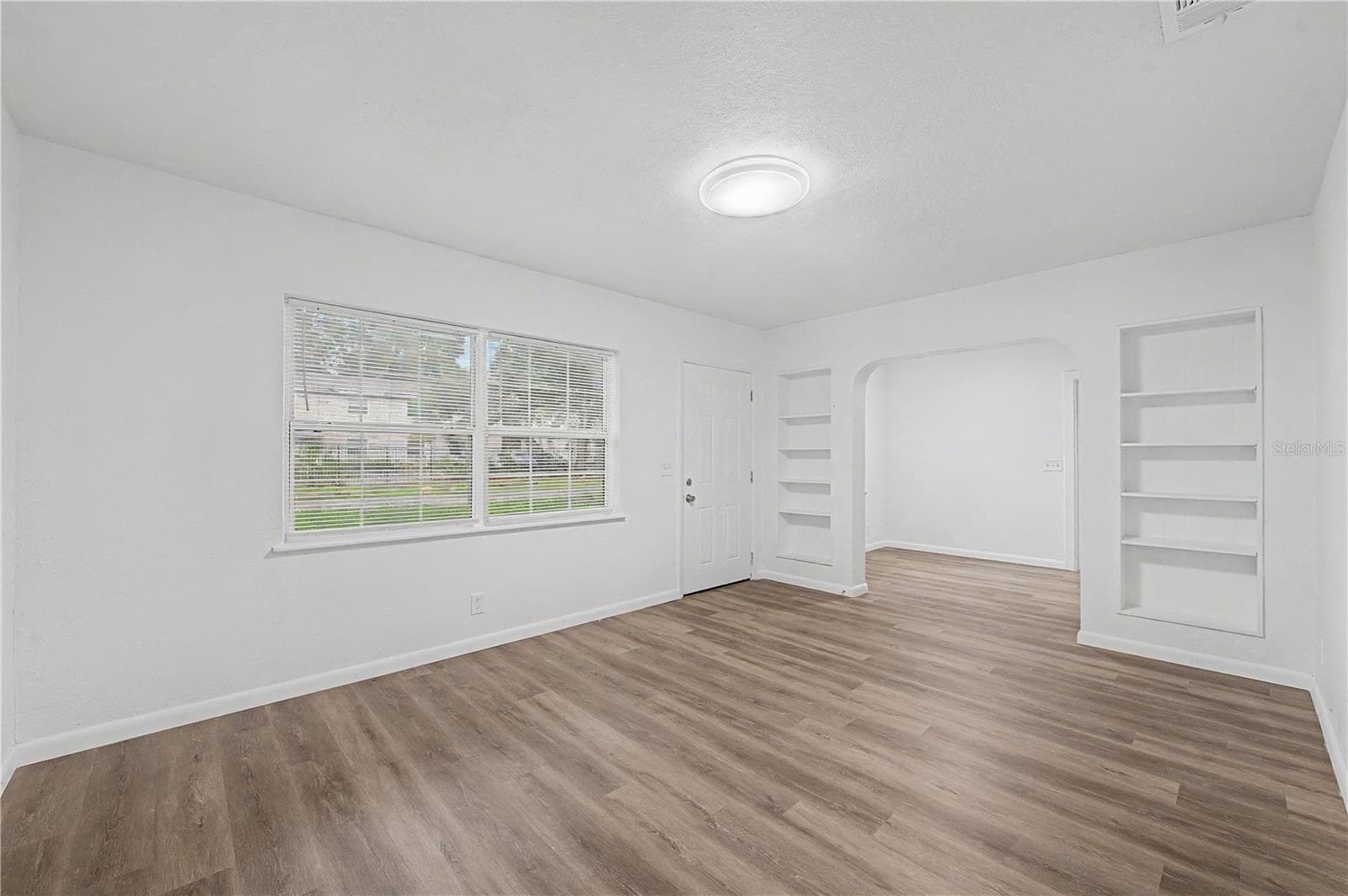 Great Room:New Flooring, Paint and Light fixtures. - 810 E 120TH AVE, TAMPA