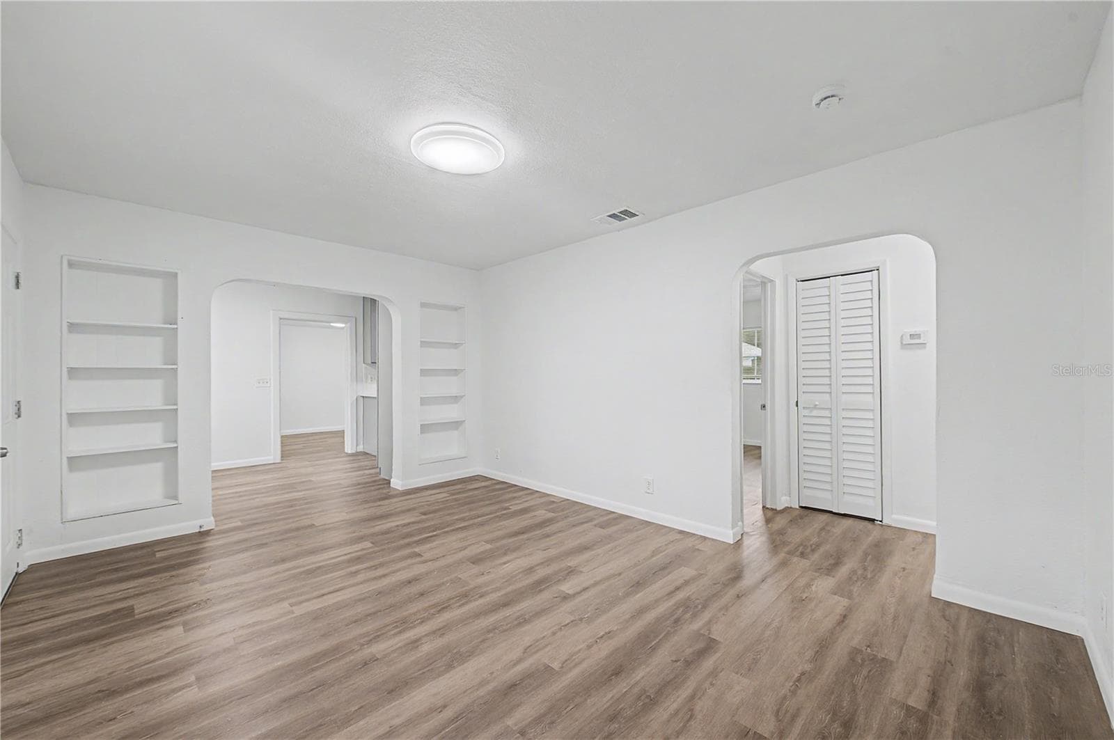 Great Room:New Flooring, Paint and Light fixtures. - 810 E 120TH AVE, TAMPA