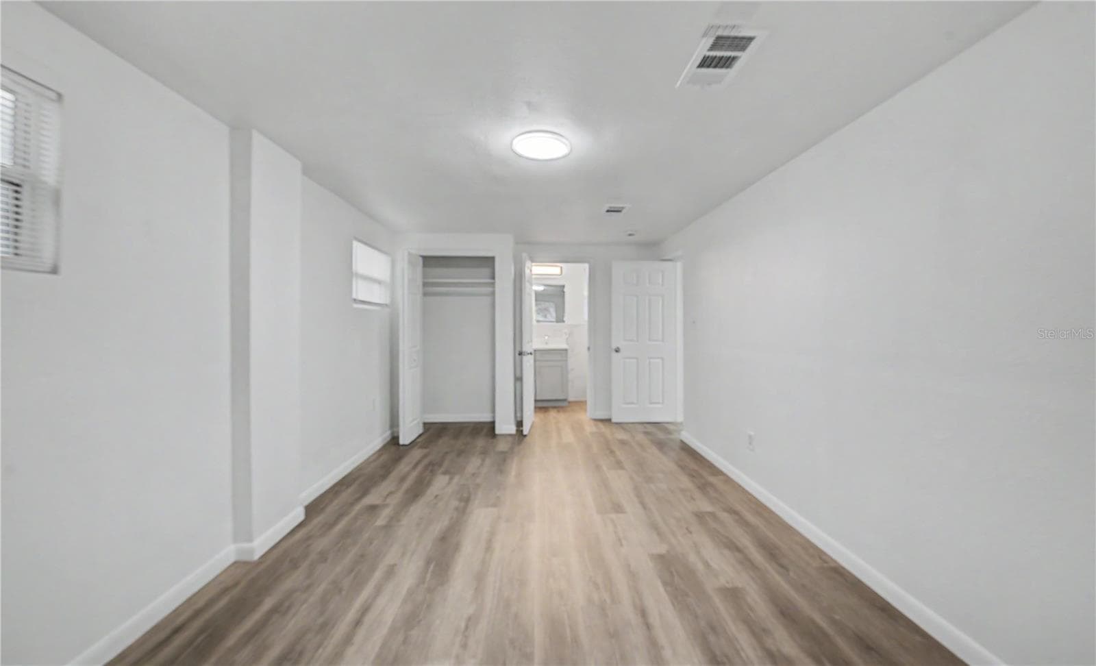 Primary Bedroom, New Paint, Light fixture and Flooring. - 810 E 120TH AVE, TAMPA