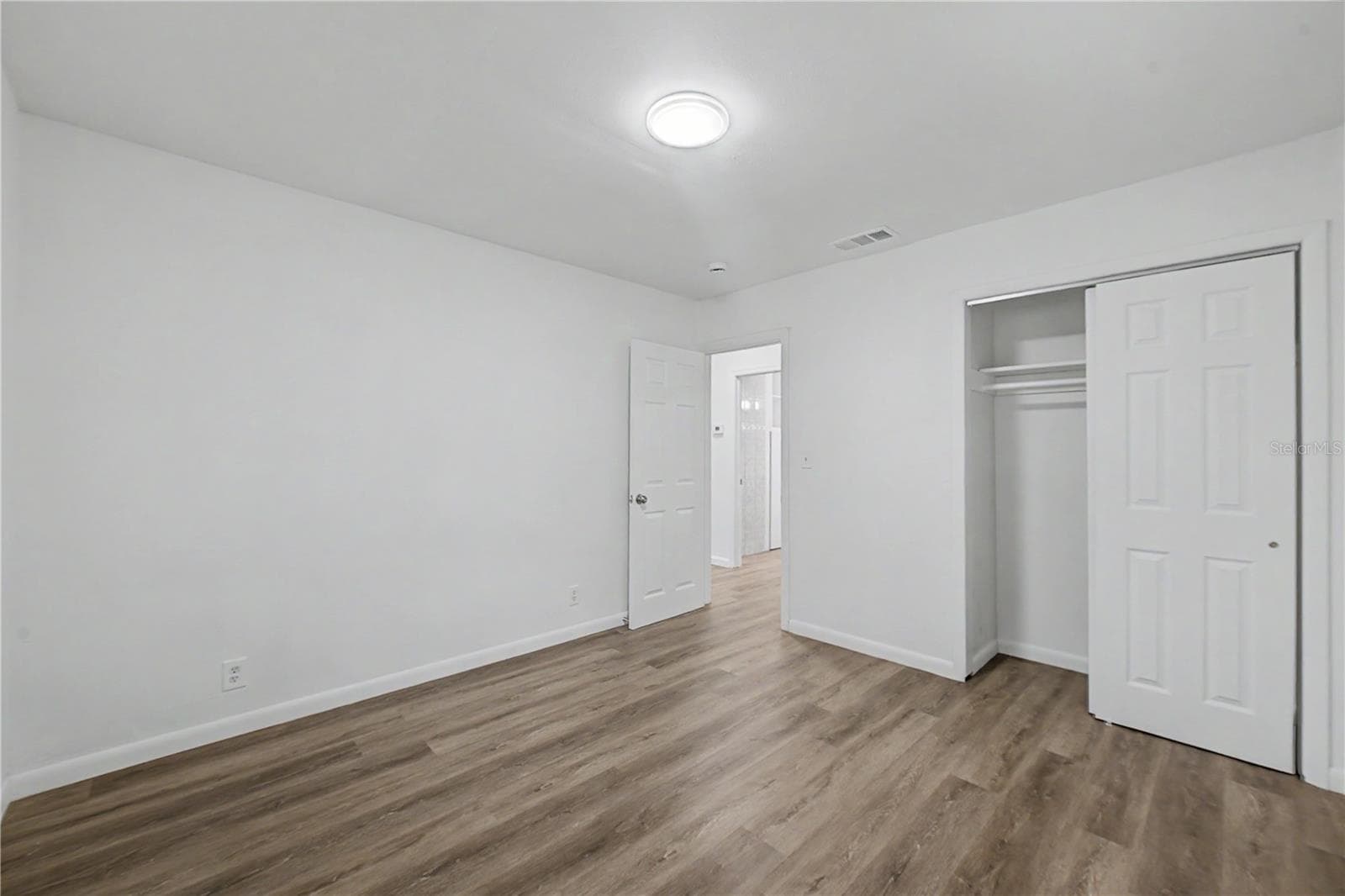 Guest Bedroom, New Flooring, Paint and Light fixture. - 810 E 120TH AVE, TAMPA