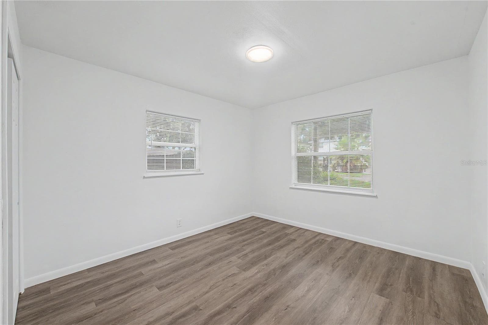 Guest Bedroom, New Flooring, Paint and Light fixture. - 810 E 120TH AVE, TAMPA