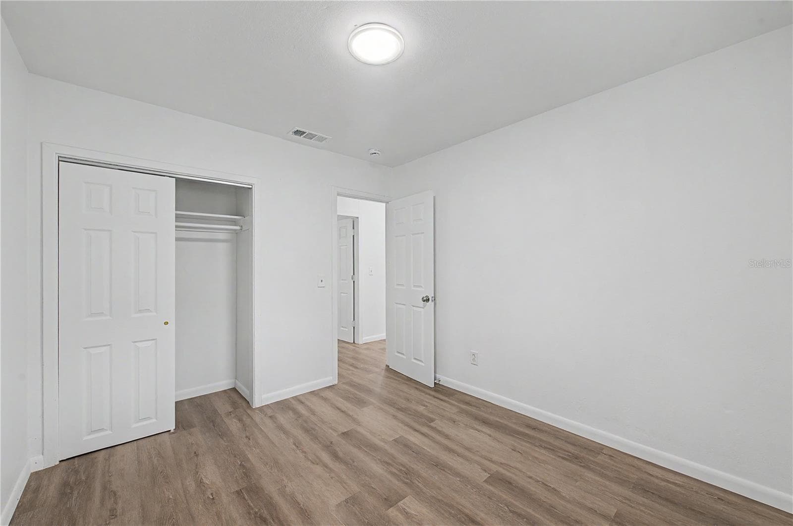 Guest Bedroom, New Flooring, Paint and Light fixture. - 810 E 120TH AVE, TAMPA