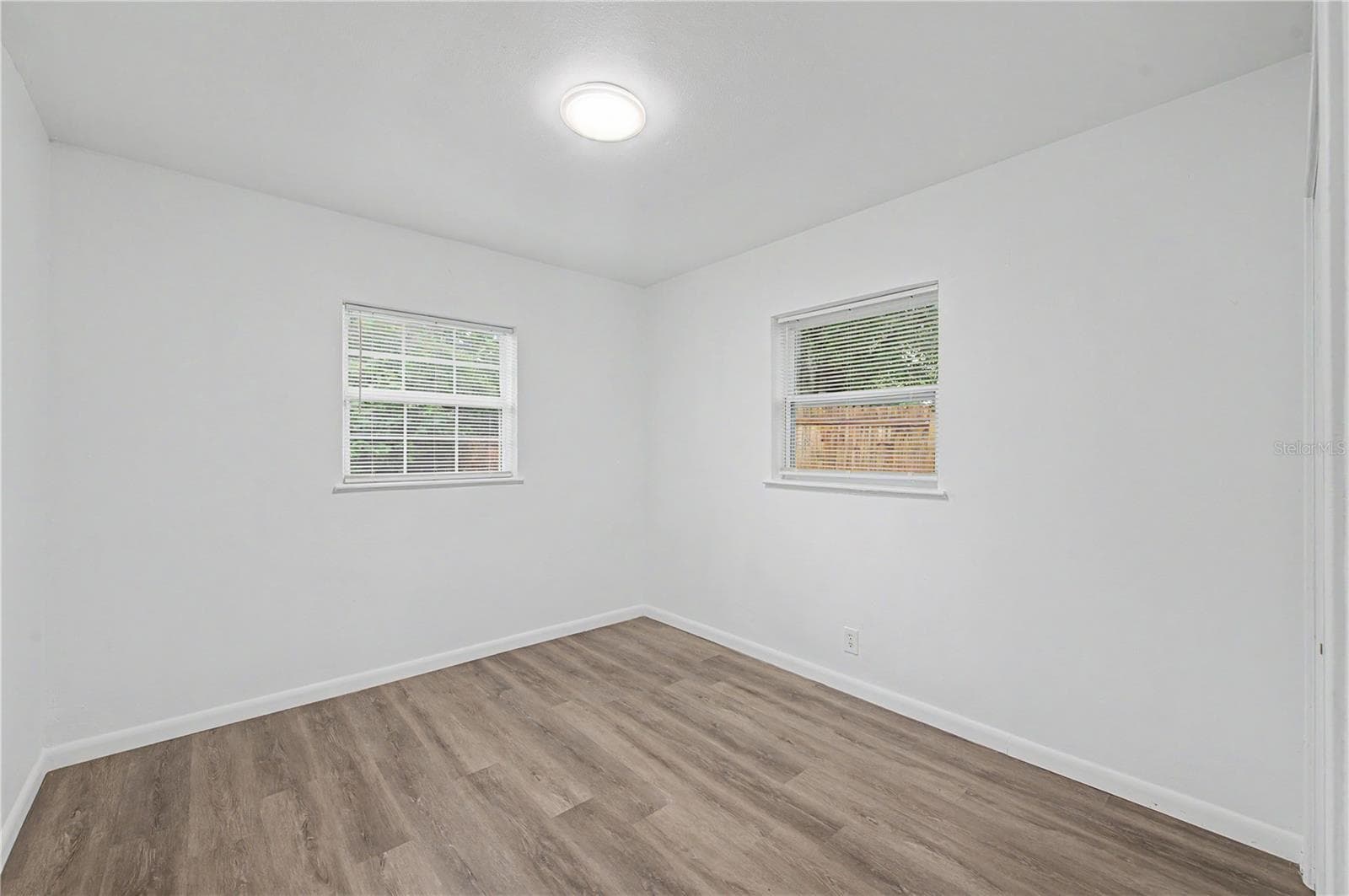Guest Bedroom, New Flooring, Paint and Light fixture. - 810 E 120TH AVE, TAMPA