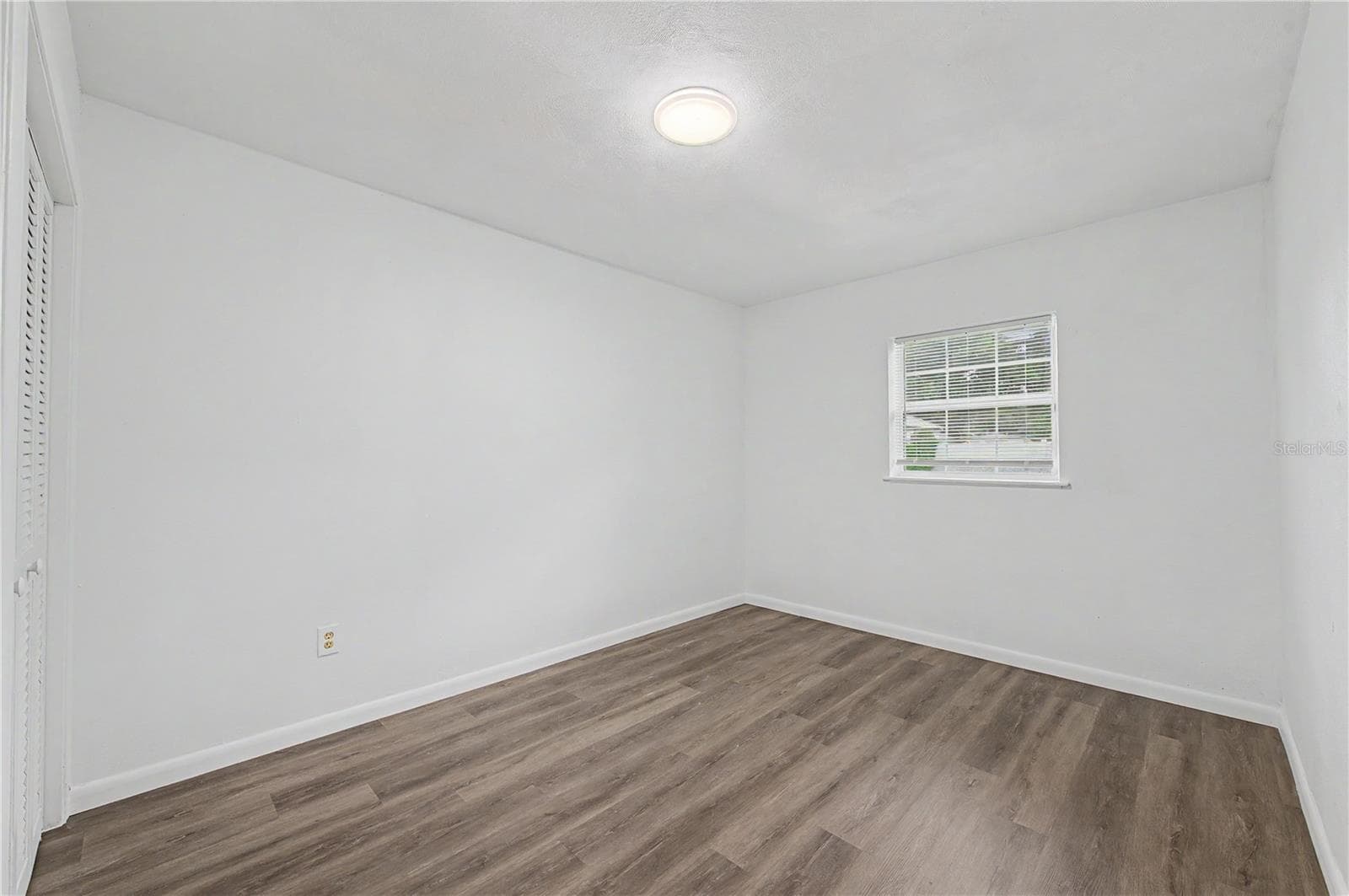 Guest Bedroom, New Flooring, Paint and Light fixture. - 810 E 120TH AVE, TAMPA
