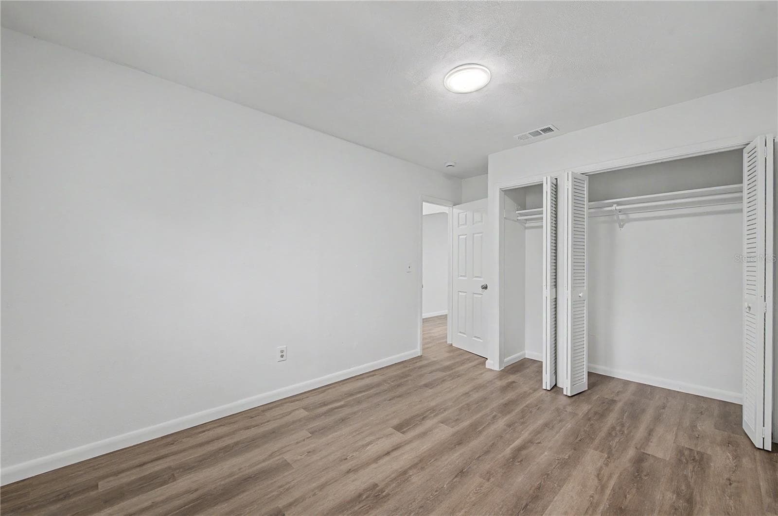 Guest Bedroom, New Flooring, Paint and Light fixture. - 810 E 120TH AVE, TAMPA