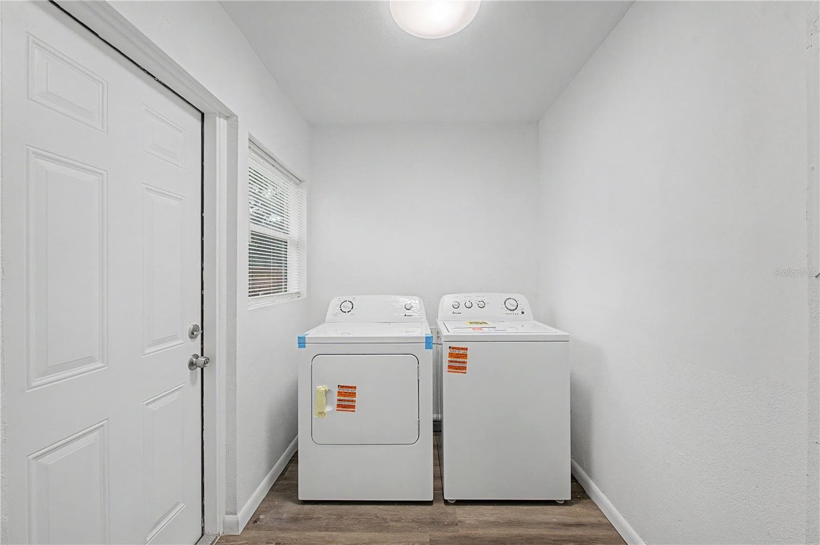 Laundry Room - New floors, paint and light fixture. - 810 E 120TH AVE, TAMPA