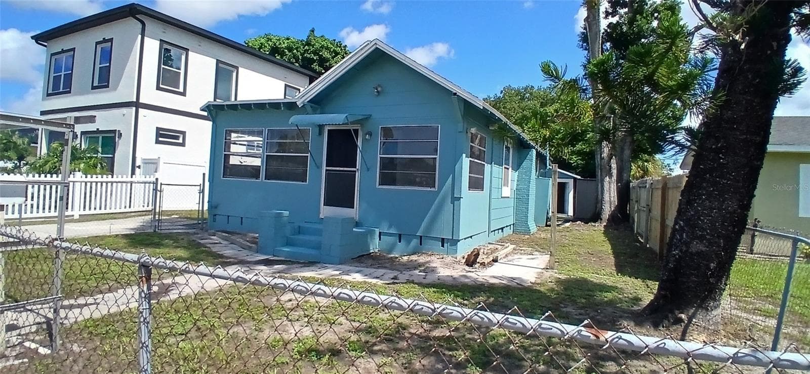 Exterior Front with New Contruction Next doorr - 2055 28TH AVE N, ST PETERSBURG