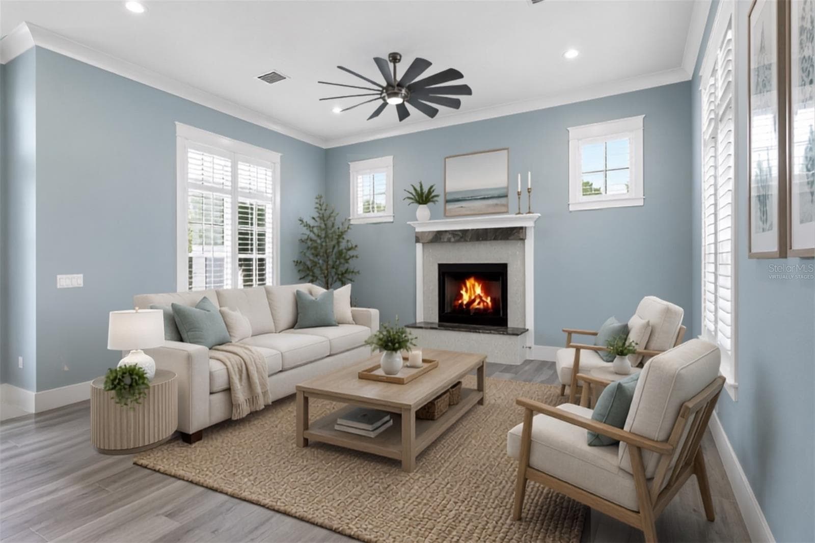 Virtually staged ground floor living space . A light-filled retreat with plantation shutters centered around a custom granite gas fireplace, perfect for unwind-and-relax evenings. - 4024 11TH STREET CT W, PALMETTO