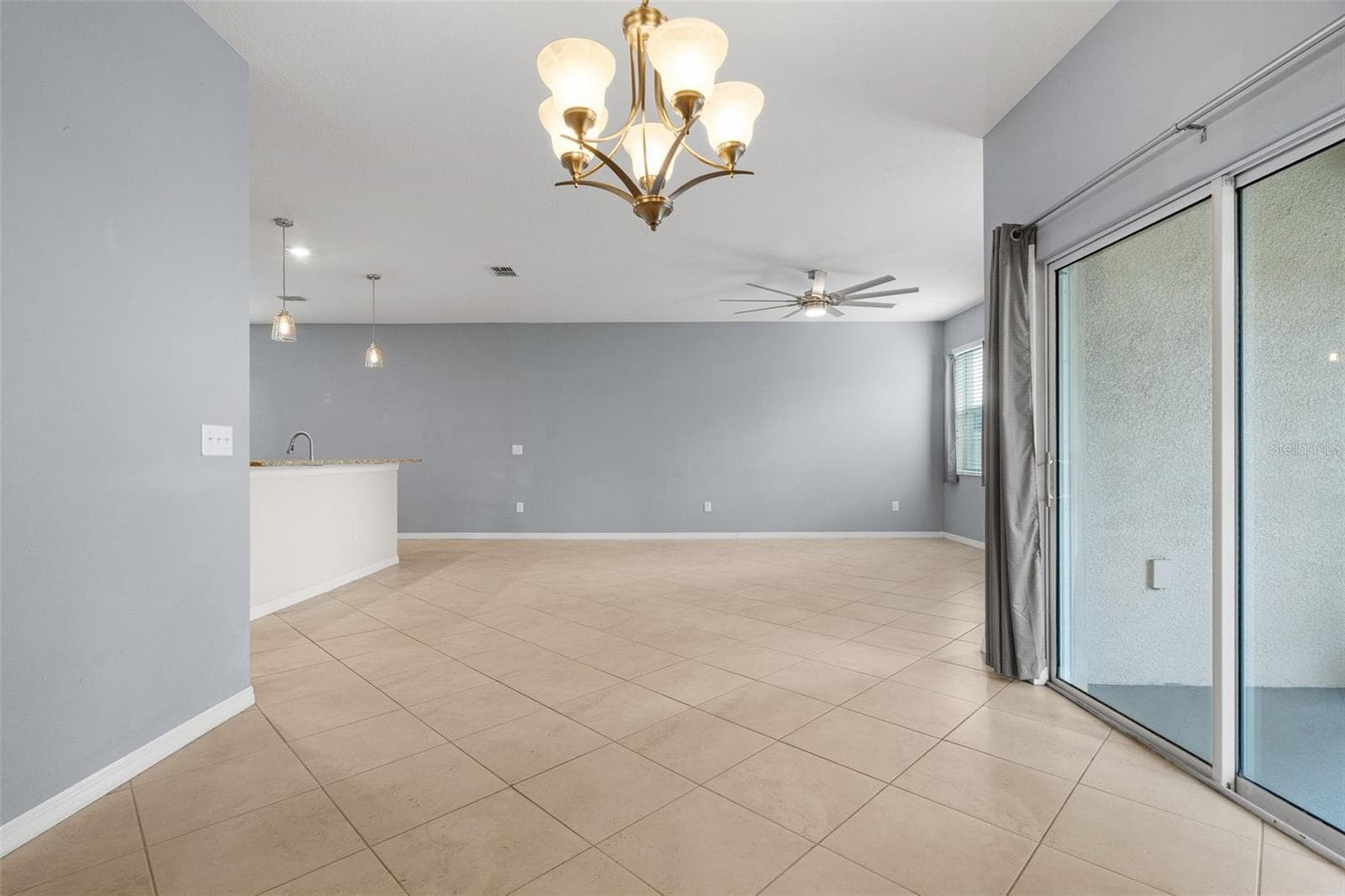 Dining & Living Area — Open dining and living spaces offer a flexible layout with abundant room for entertaining. - 13728 REINDEER CIR, HUDSON