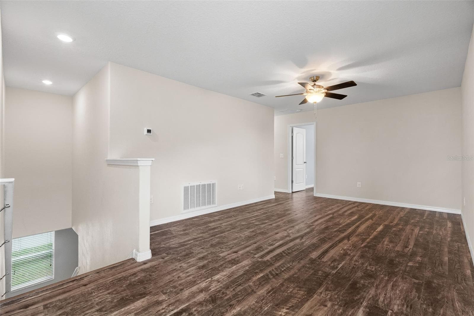 Upstairs Loft — Spacious upstairs loft provides flexible additional living space for a media room, home office, or recreation area. - 13728 REINDEER CIR, HUDSON
