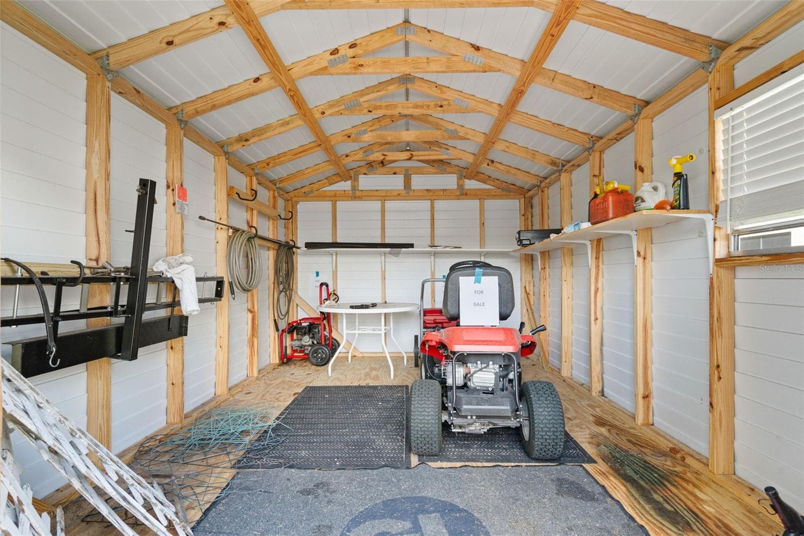 Storage Shed – Spacious backyard storage shed providing excellent additional storage for lawn equipment, tools, and more. - 13728 REINDEER CIR, HUDSON