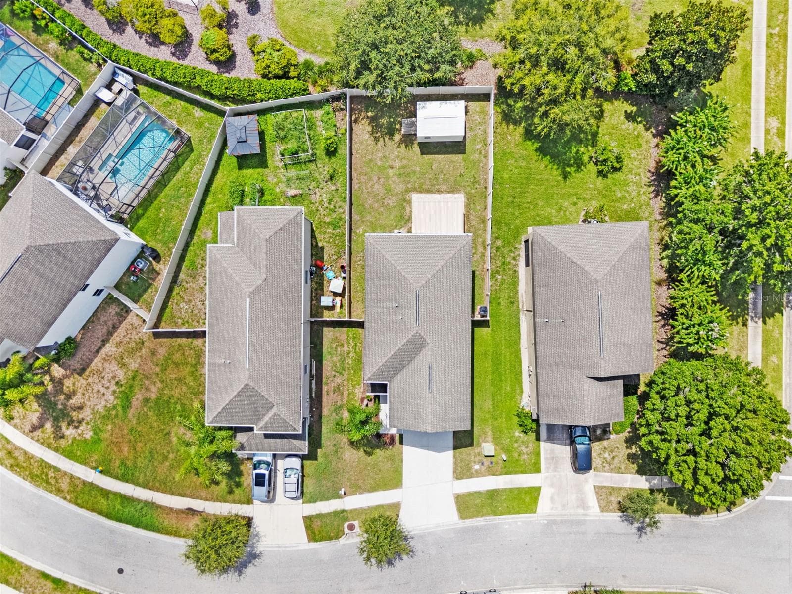 Overhead Property View – Direct overhead aerial providing a clear view of the home, driveway, backyard, and surrounding properties. - 13728 REINDEER CIR, HUDSON