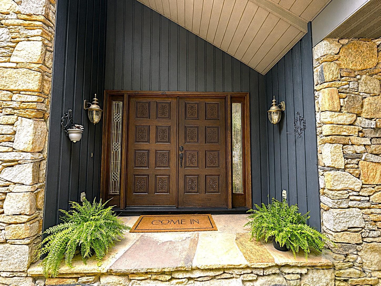 Carved detail in this front door make it stand out above the rest. - 1105 High Vista Drive, Mills River