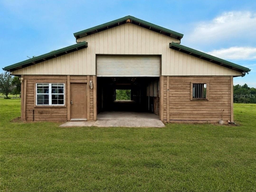 Stable Barn- Grass gently greened with AI to demonstrate current conditions. - 24087 TWISTER LN, BROOKSVILLE