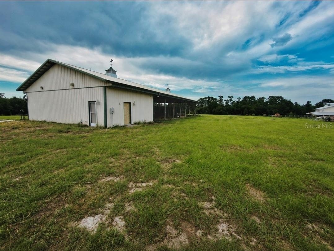 Pole Barn - Grass gently greened with AI to demonstrate current conditions. - 24087 TWISTER LN, BROOKSVILLE