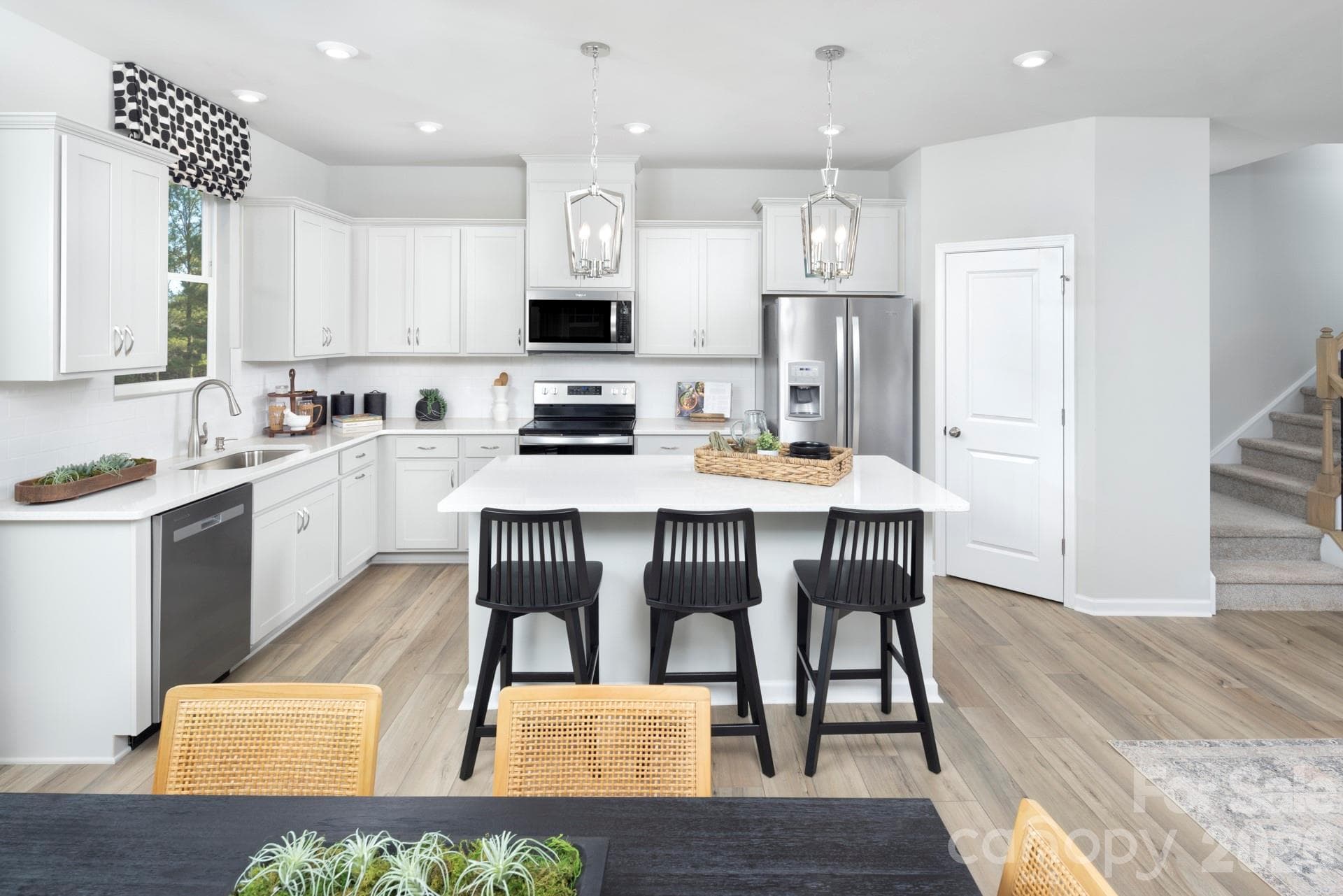 Photos shown are of a staged model home and are for illustrative purposes only. Floor plan is the same; however, finishes, colors, features, fixtures, furnishings, and design selections may vary from the actual home. - Charlotte