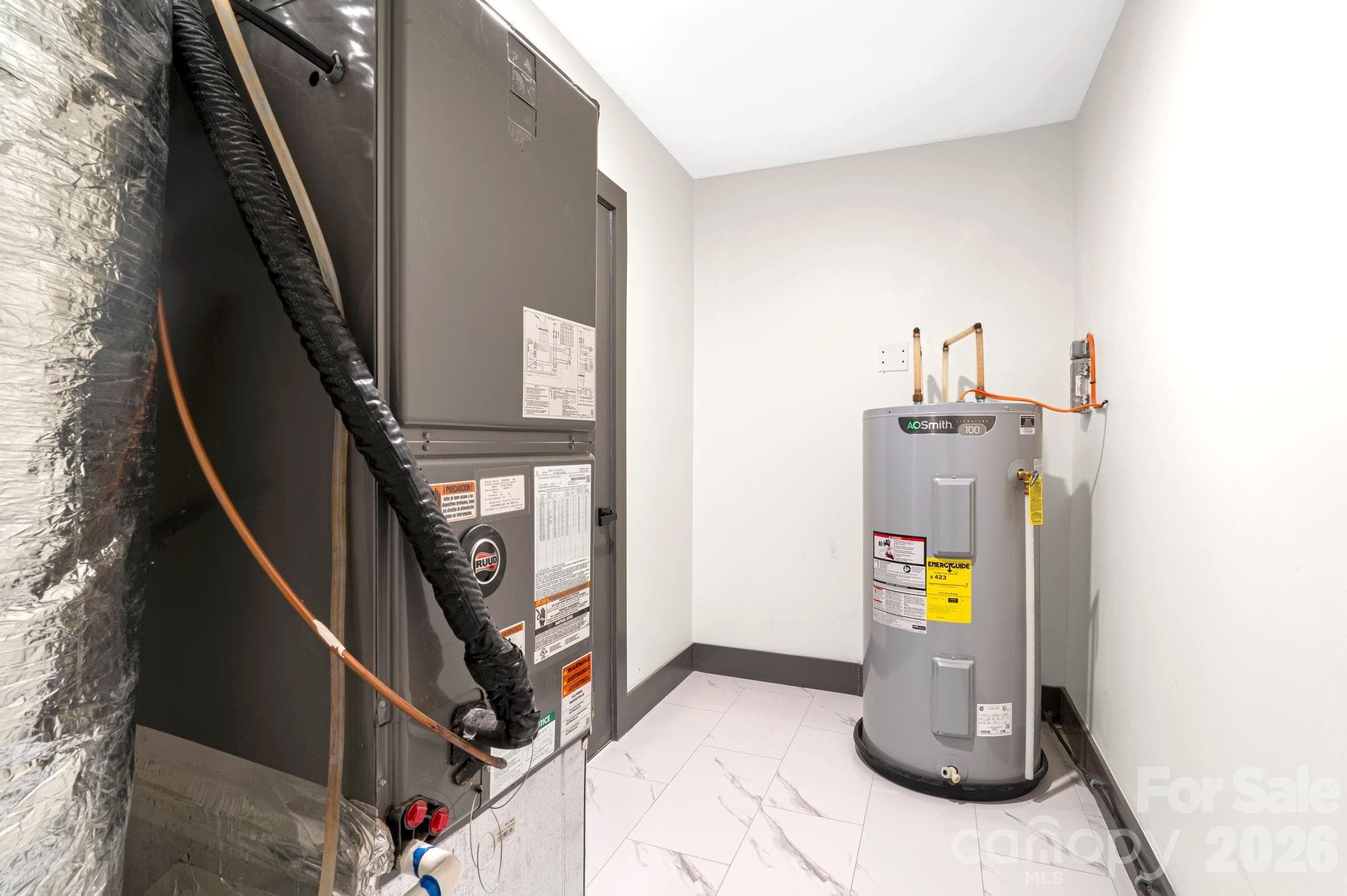 Dedicated utility room keeps everything organized and accessible. - Arden