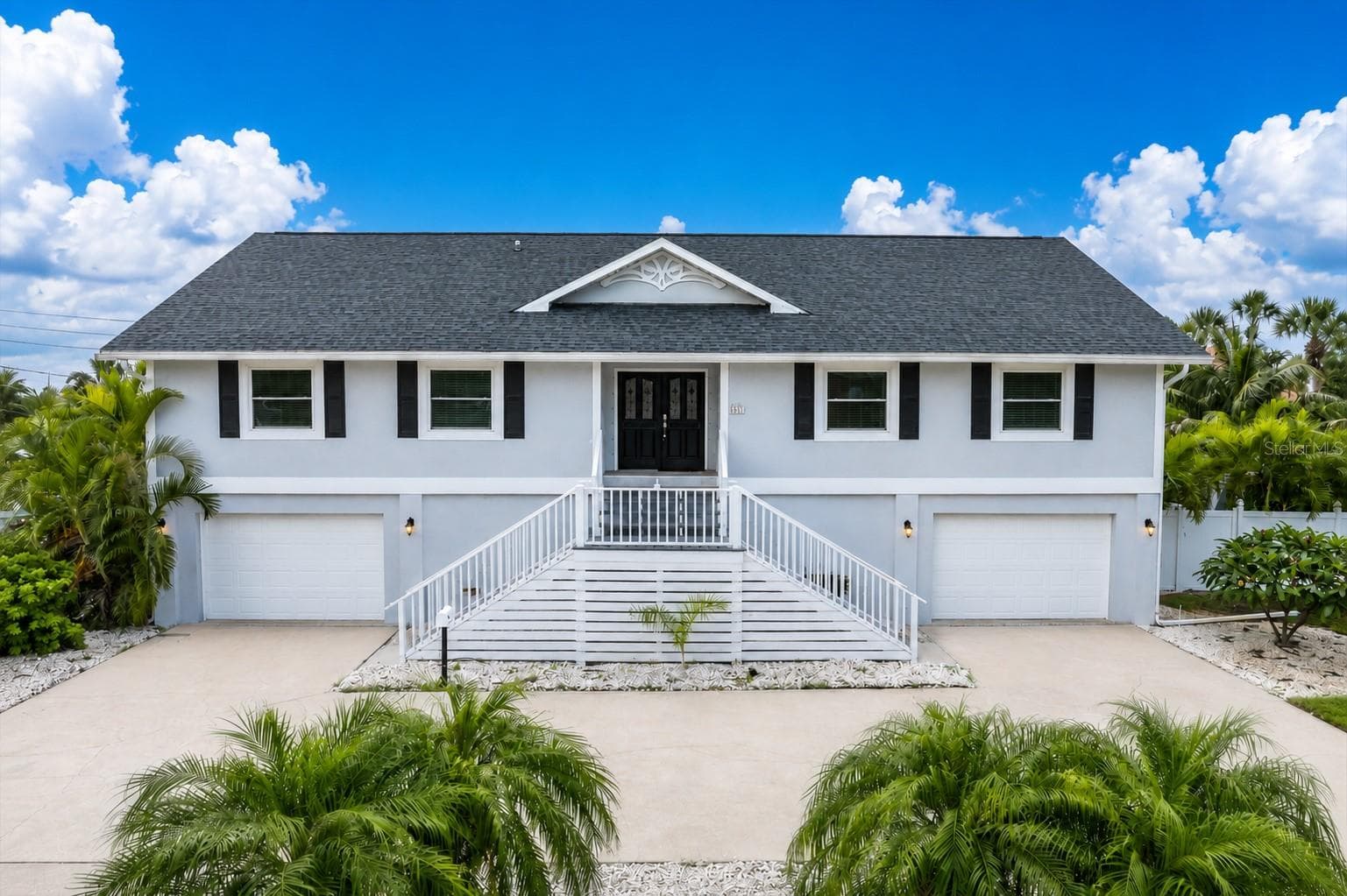 Nestled in the beautiful community of Royal Palm Villages, this lovely home is now offered for sale. - 6501 MOCKINGBIRD WAY S, GULFPORT