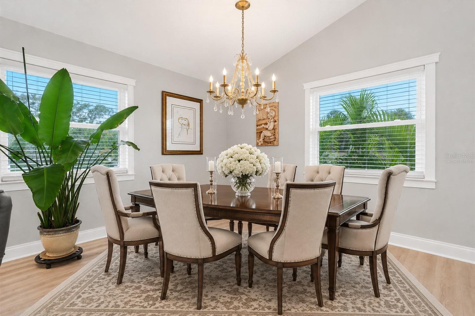 Virtually staged to illustrate how this spacious, versatile area can easily accommodate a beautiful formal dining setting. - 6501 MOCKINGBIRD WAY S, GULFPORT