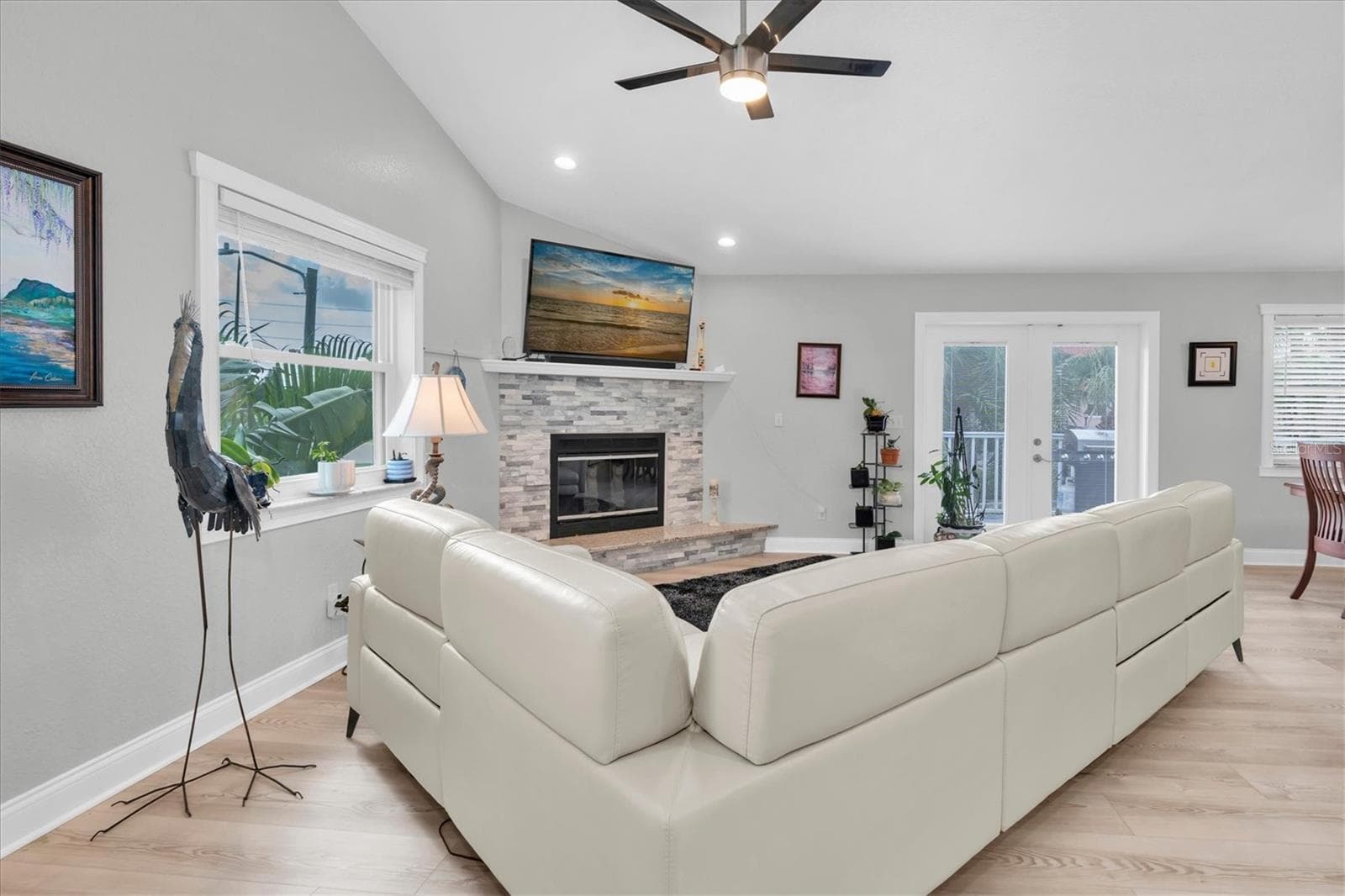 Expansive family room with generous proportions, easily accommodating a large seating arrangement while maintaining a comfortable, inviting atmosphere. - 6501 MOCKINGBIRD WAY S, GULFPORT