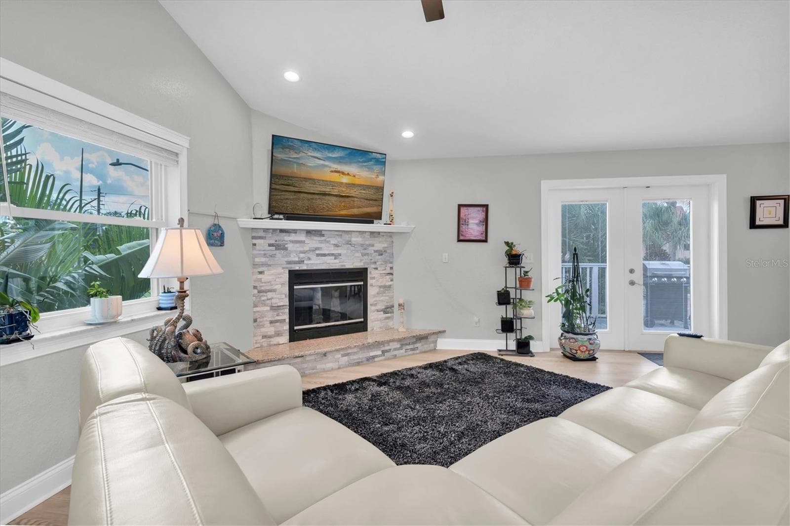 French doors open to the rear deck, where beautiful views and generous outdoor space create the perfect setting for al fresco dining and entertaining. - 6501 MOCKINGBIRD WAY S, GULFPORT