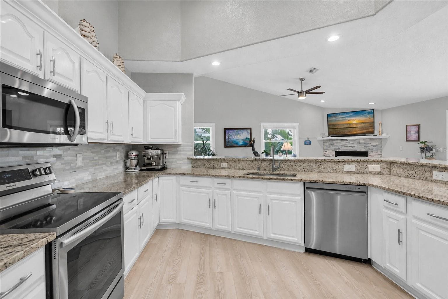 Light & bright kitchen offering abundant counter space & generous cabinetry for plenty of storage. - 6501 MOCKINGBIRD WAY S, GULFPORT