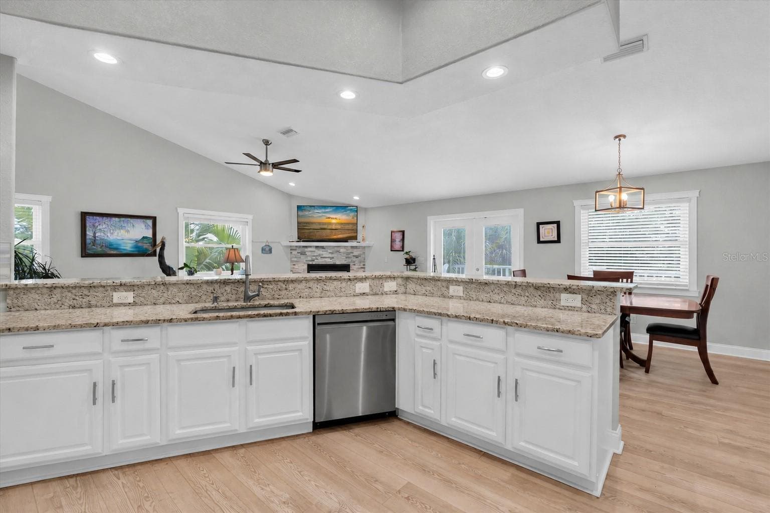 The kitchen has an abundance of natural light. Enjoy preparing meals while engaging with family and friends. - 6501 MOCKINGBIRD WAY S, GULFPORT