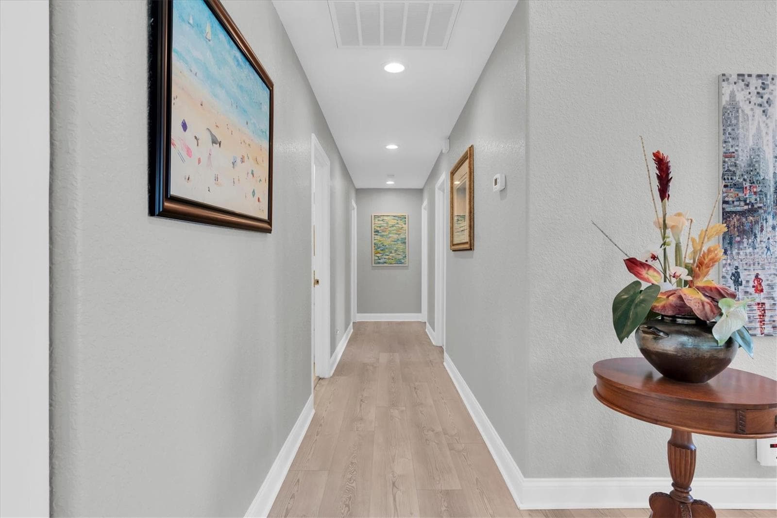 An wide hallway enhances the home’s spacious feel & provides a comfortable, open flow between the living areas & bedrooms.” - 6501 MOCKINGBIRD WAY S, GULFPORT