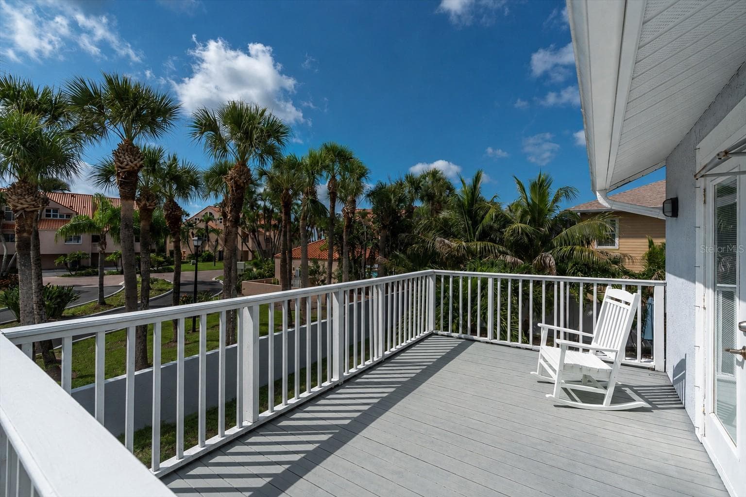 Step outdoors from the primary bedroom and enjoy the tropical oasis! - 6501 MOCKINGBIRD WAY S, GULFPORT