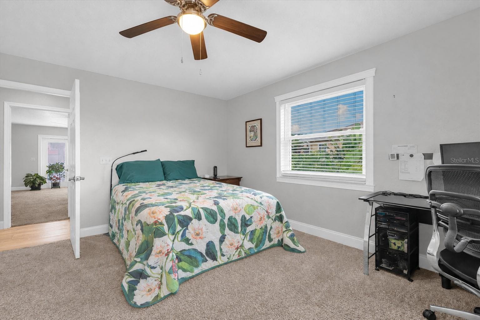 The generously sized second bedroom offers a warm & welcoming atmosphere, creating a comfortable retreat for rest & relaxation. - 6501 MOCKINGBIRD WAY S, GULFPORT