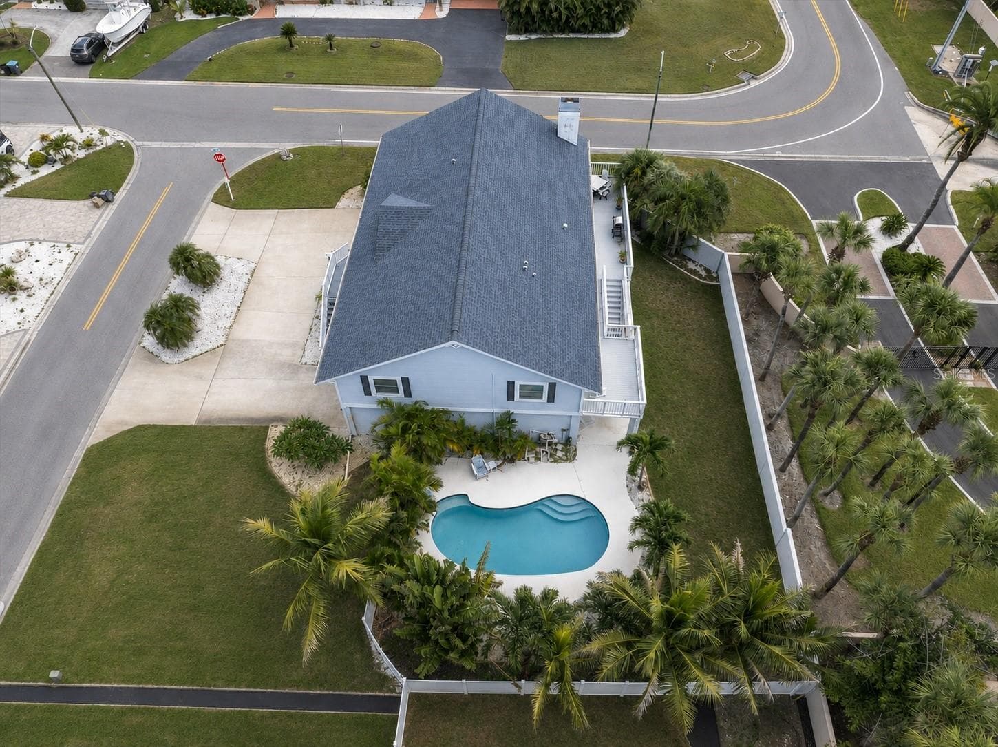 This spacious home is situated on a generously sized lot, with a circular driveway providing convenient access & ample room for additional vehicles. - 6501 MOCKINGBIRD WAY S, GULFPORT