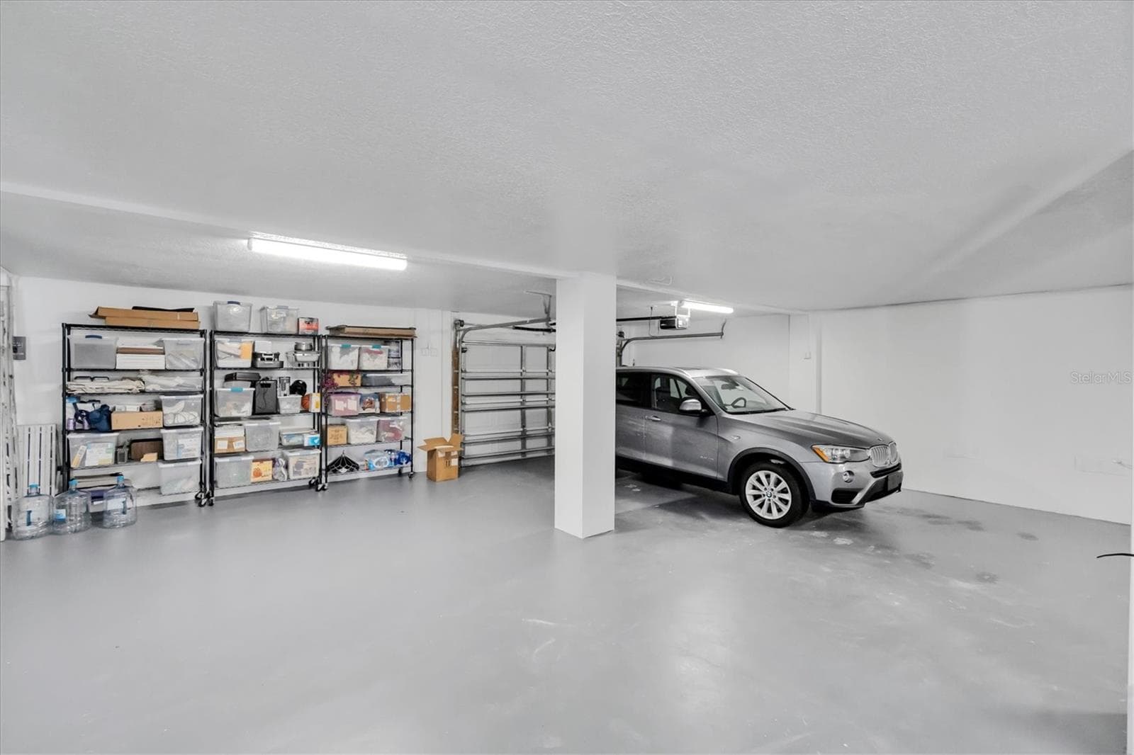 Beyond accommodating multiple vehicles, this expansive garage offers exceptional additional space for a workshop, hobbies, storage & a variety of other uses. - 6501 MOCKINGBIRD WAY S, GULFPORT