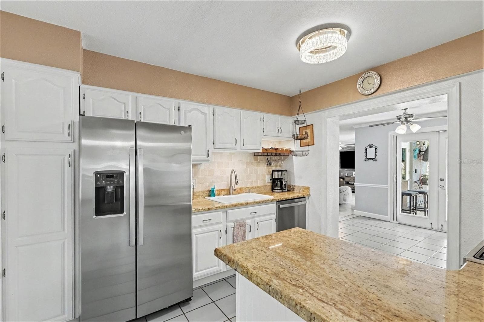stainless steel appliances and granite counter tops. View towards the huge family room. - 12321 82ND AVE, SEMINOLE