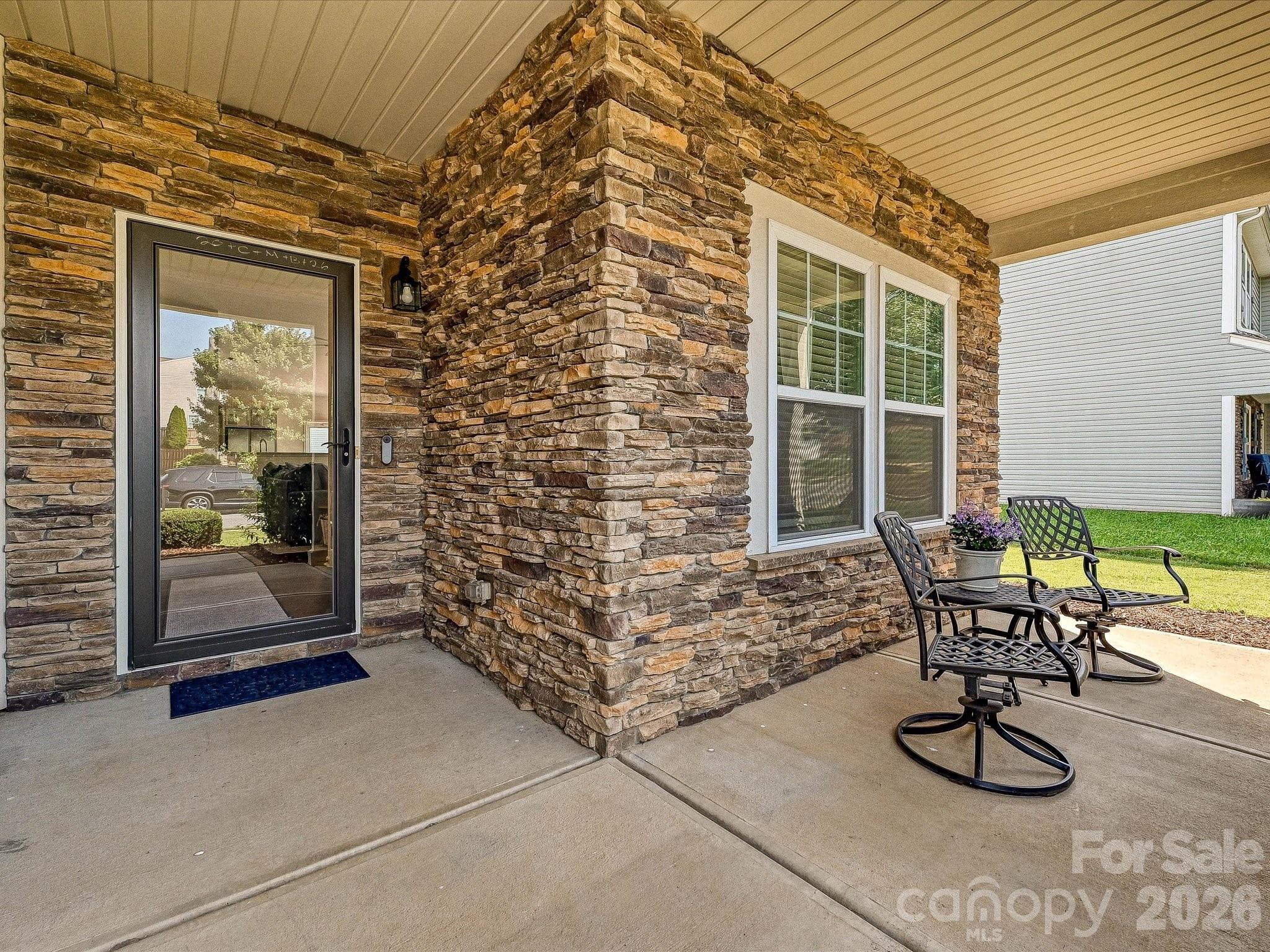 ...featuring a beautiful stone facade - 216 Austin Field Court, Mount Holly