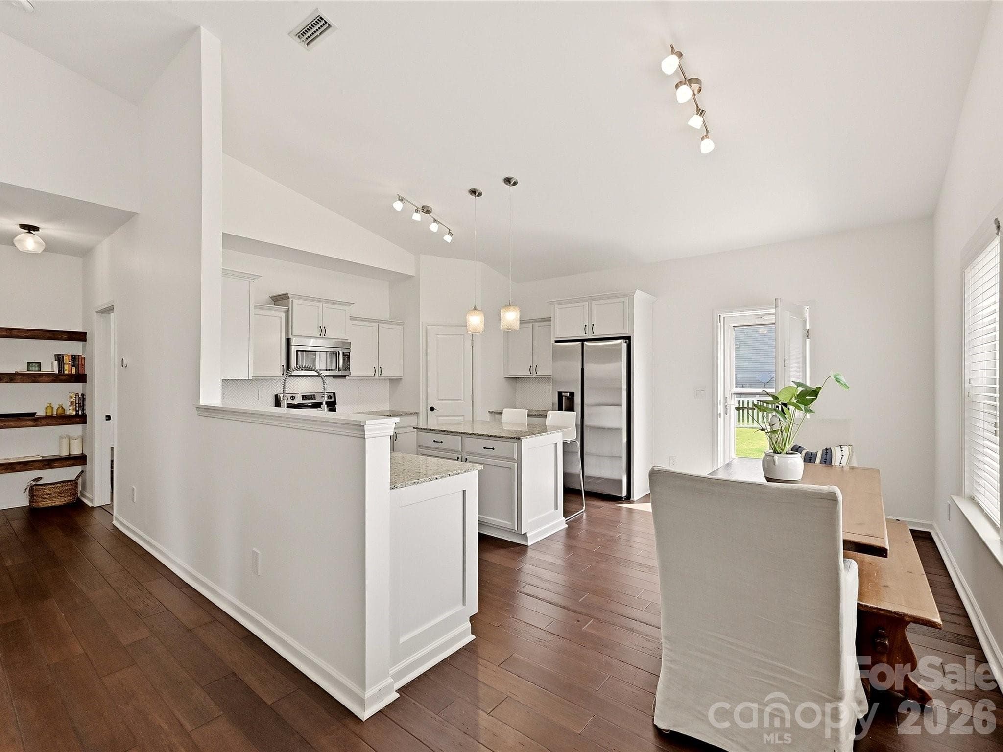 separated only by a half wall, a beautiful kitchen invites - 216 Austin Field Court, Mount Holly