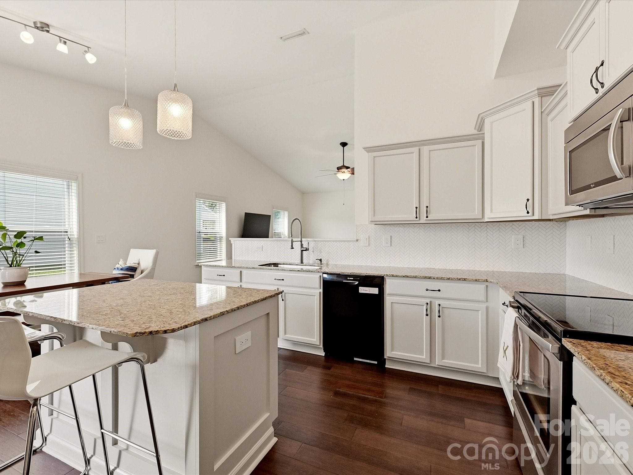 A combination of stainless and black appliances lend modern appeal - 216 Austin Field Court, Mount Holly