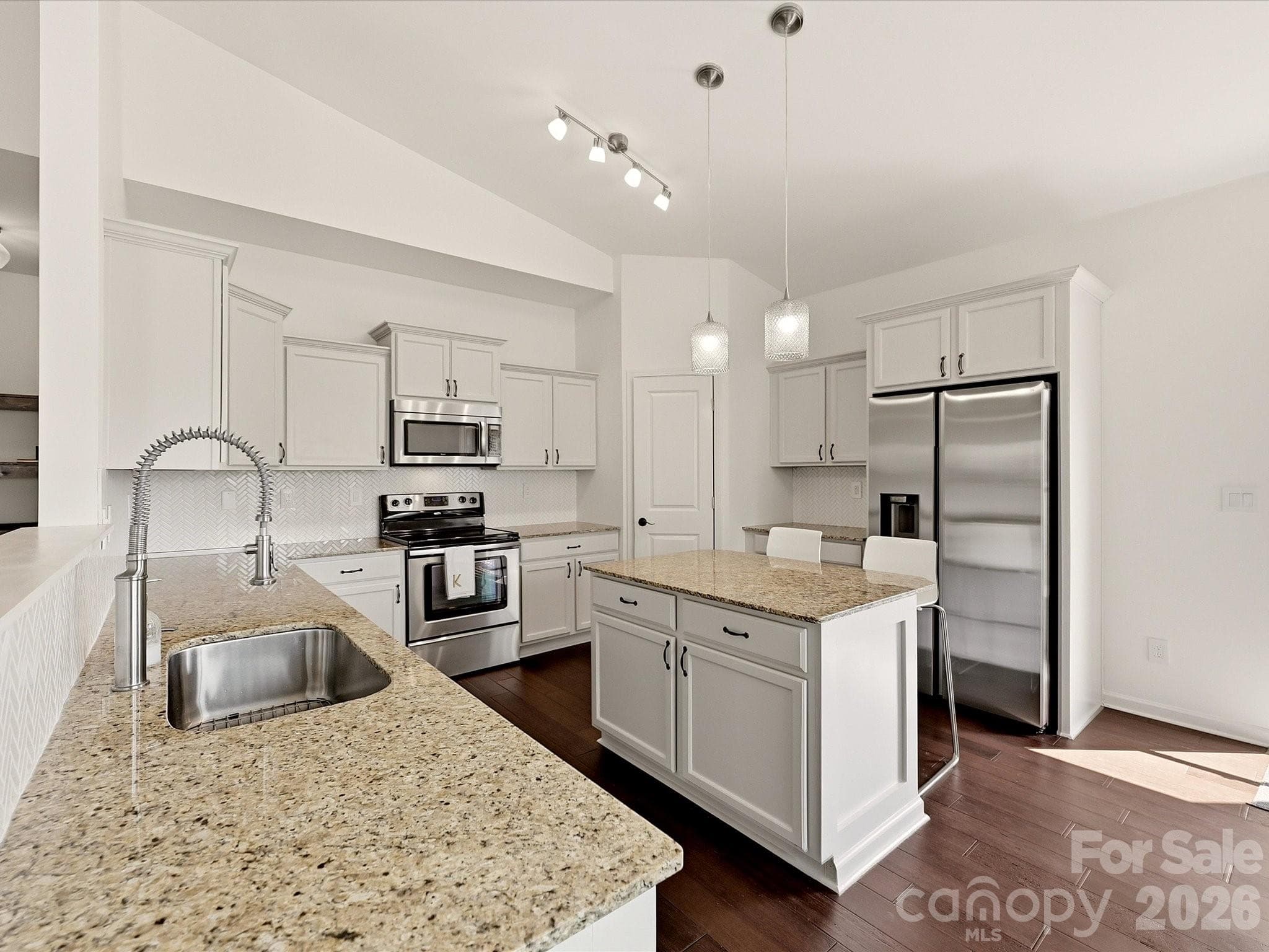 Granite countertops and Pendant lighting are featured - 216 Austin Field Court, Mount Holly