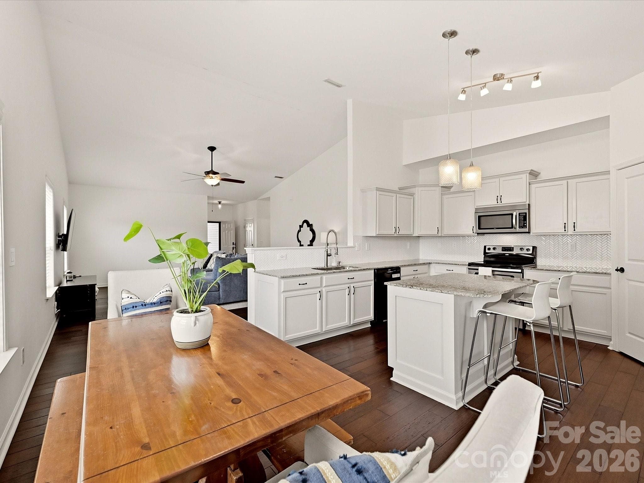 A southern exposure makes this living area bright - 216 Austin Field Court, Mount Holly