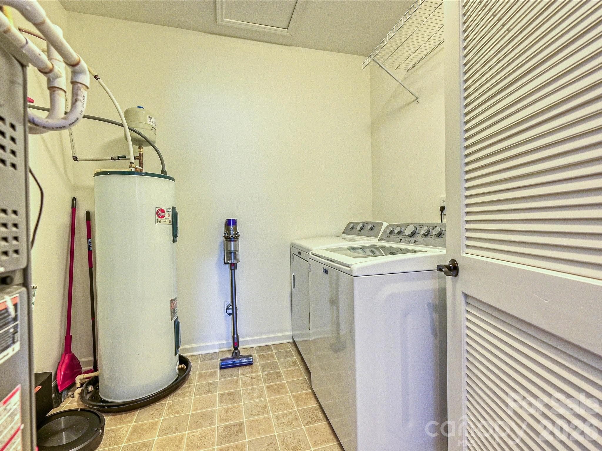 All utilities are easily accessible in this functional laundry room - 216 Austin Field Court, Mount Holly