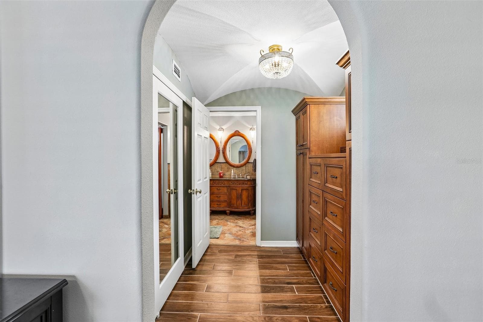Large closet and dressing area entering into the primary bathroom - 3131 N CANAL DR, PALM HARBOR