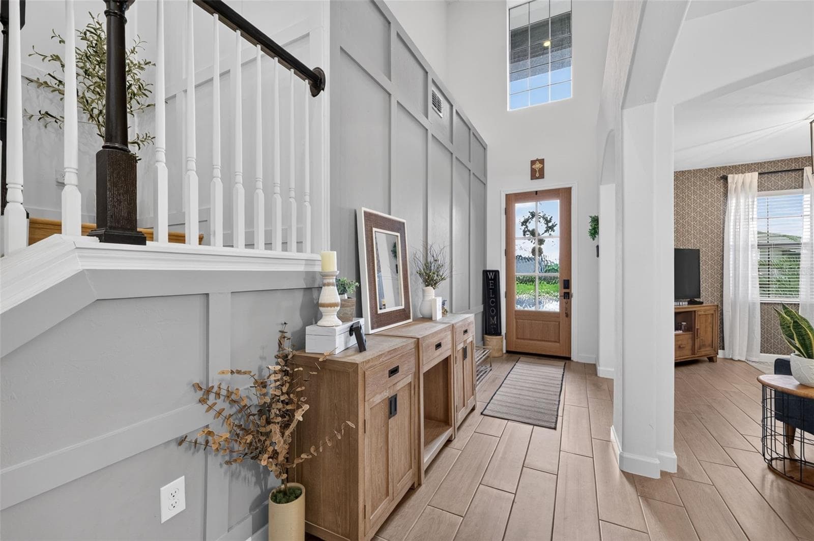Entryway with Custom Accent Wall Open to Living and Dining Room - 15008 MISTY WATER XING, BRADENTON